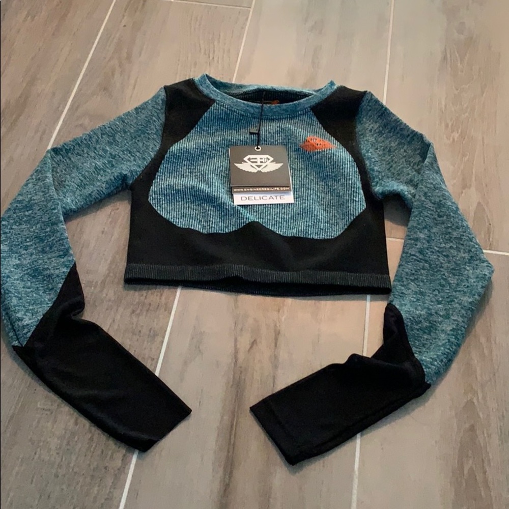 Engineered life tea and black active crop top. New